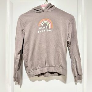 Girls grey hoodie “Smile/rainbow” Detail. Cinched elastic waist band. Size 8/10.